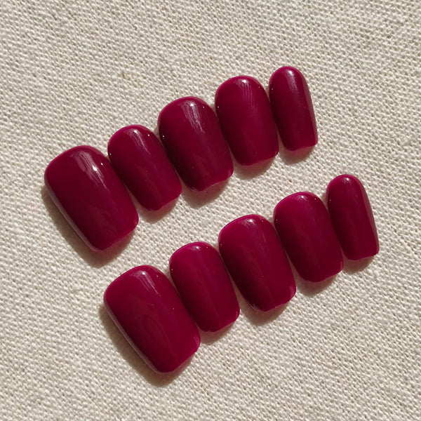 Calm Storm premium handmade press-on nails in deep magenta in extra short square. 