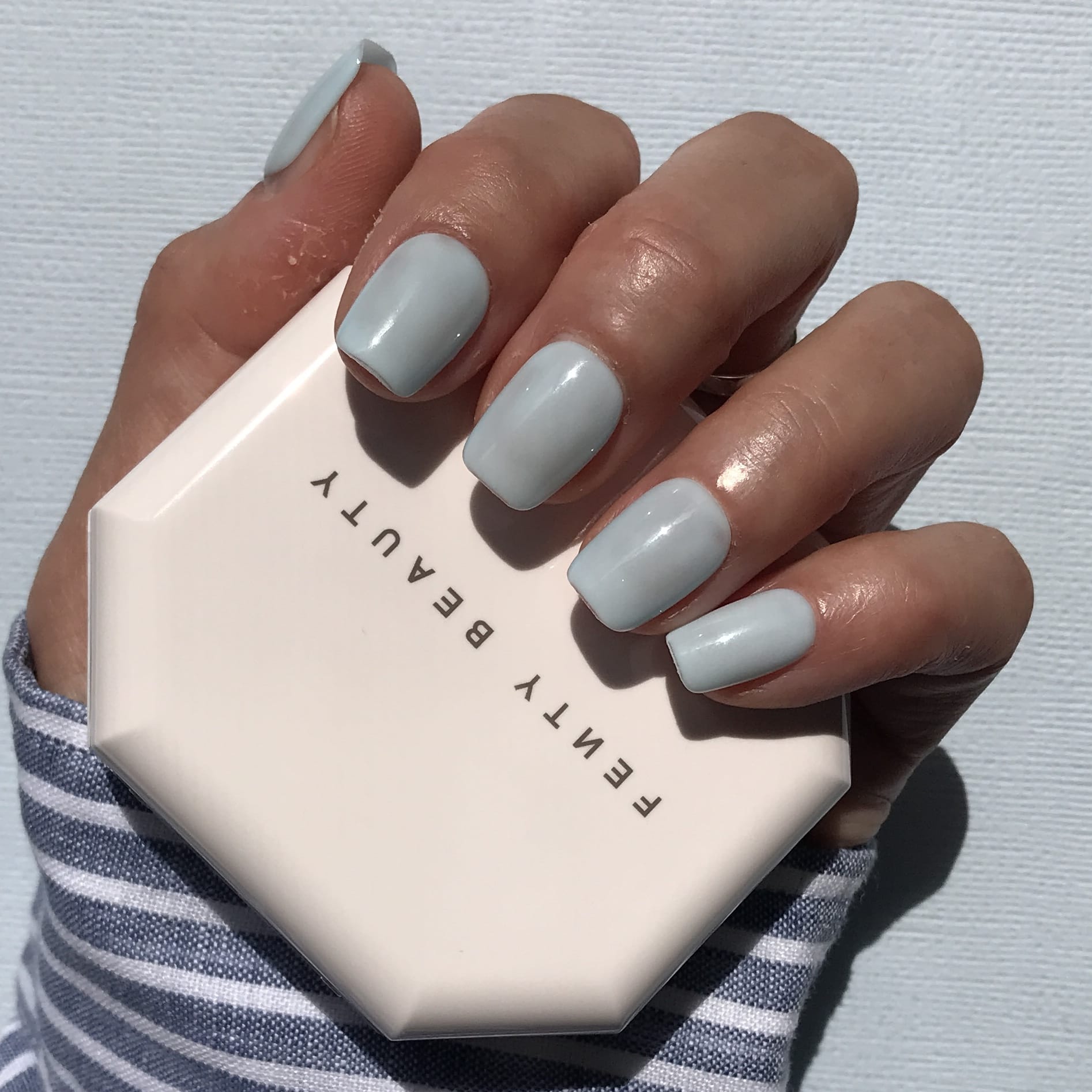 Calm Storm premium press-on nails in pale blue short square. 