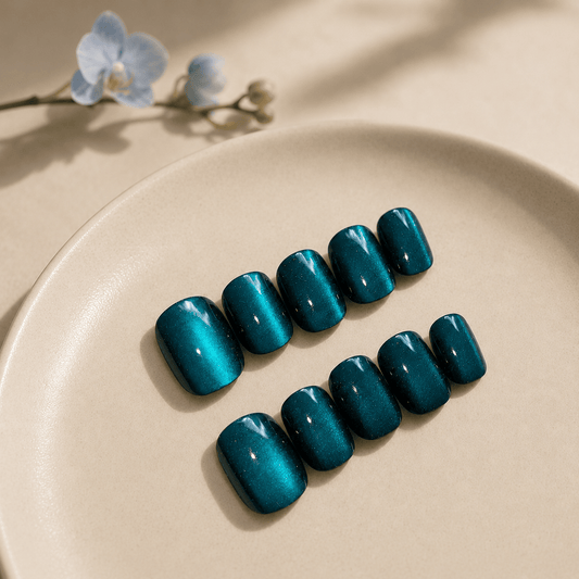 Calm Storm handmade teal blue press on nails in teal blue cat eye in extra short. 