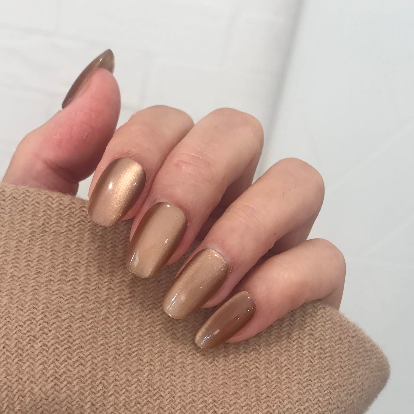 Calm Storm premium toffee cat eye press on nails close up. 