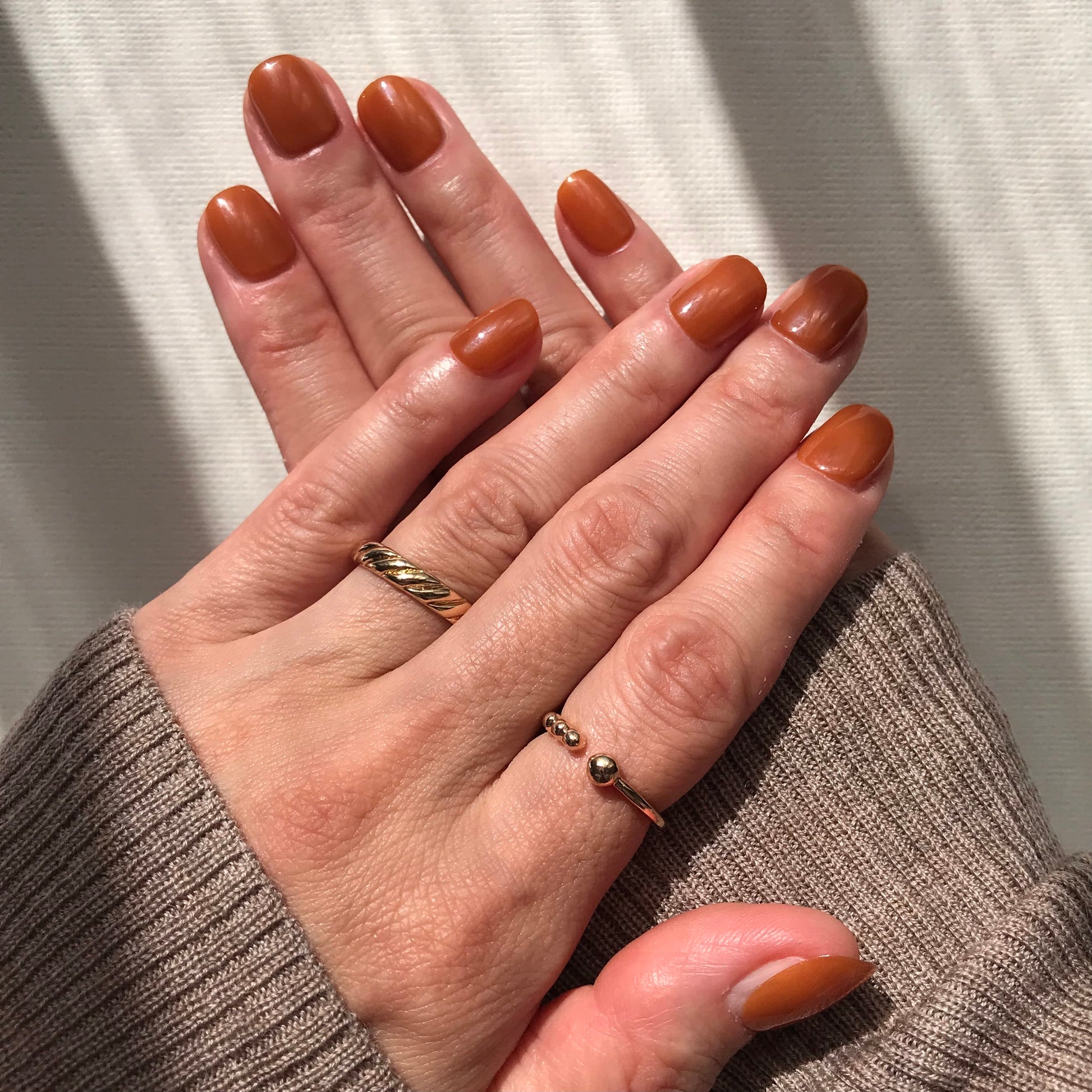 Calm Storm premium handmade press-on nails in rich toffee in extra short. 