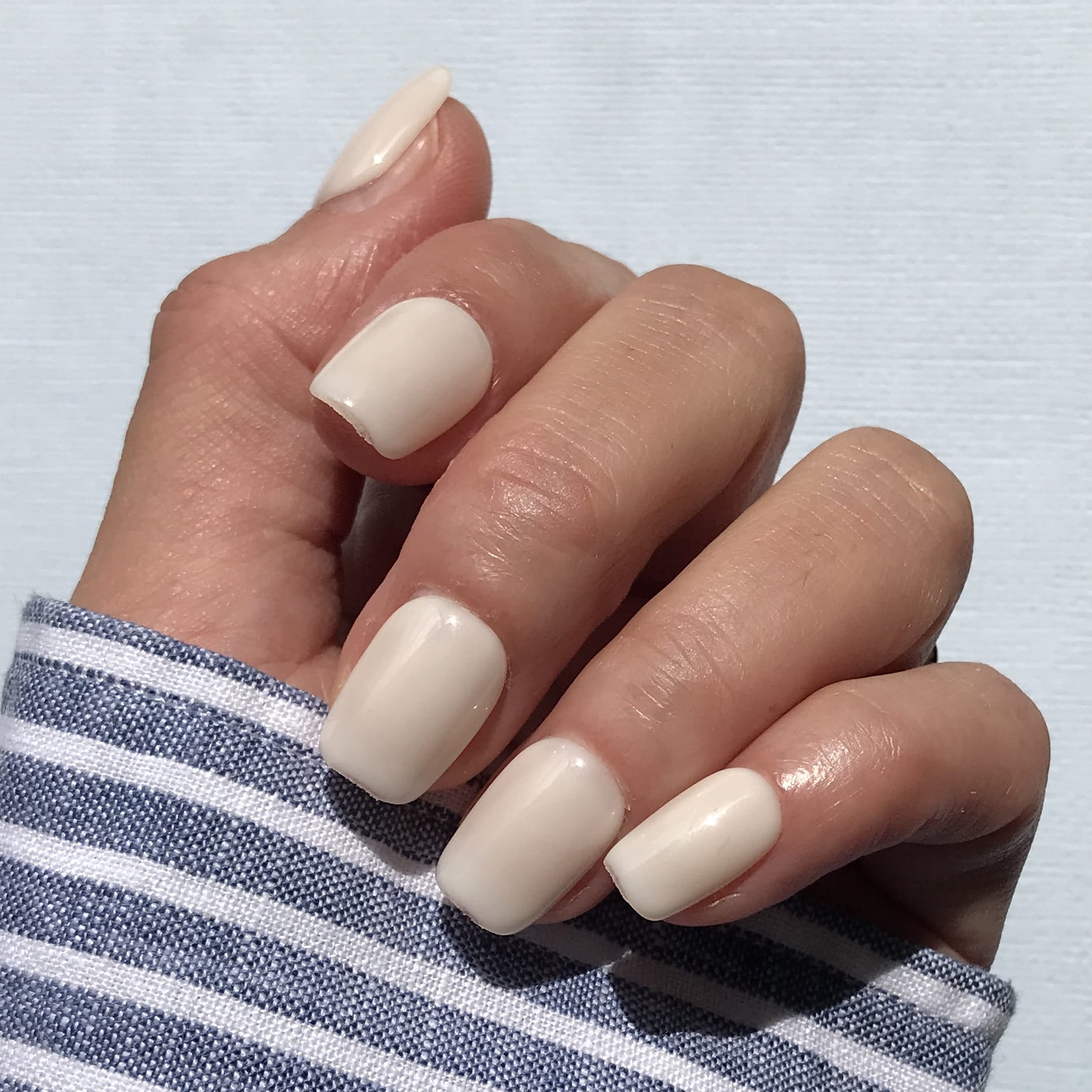 Calm Storm premium handmade press-on nails in clean white in short square. 